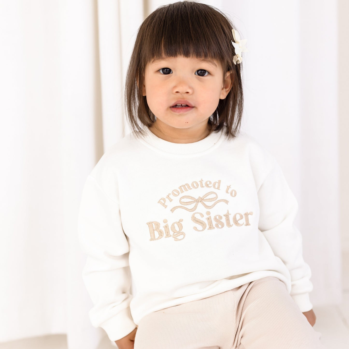 'Promoted to big sister' personalised embroidered bow sweatshirt