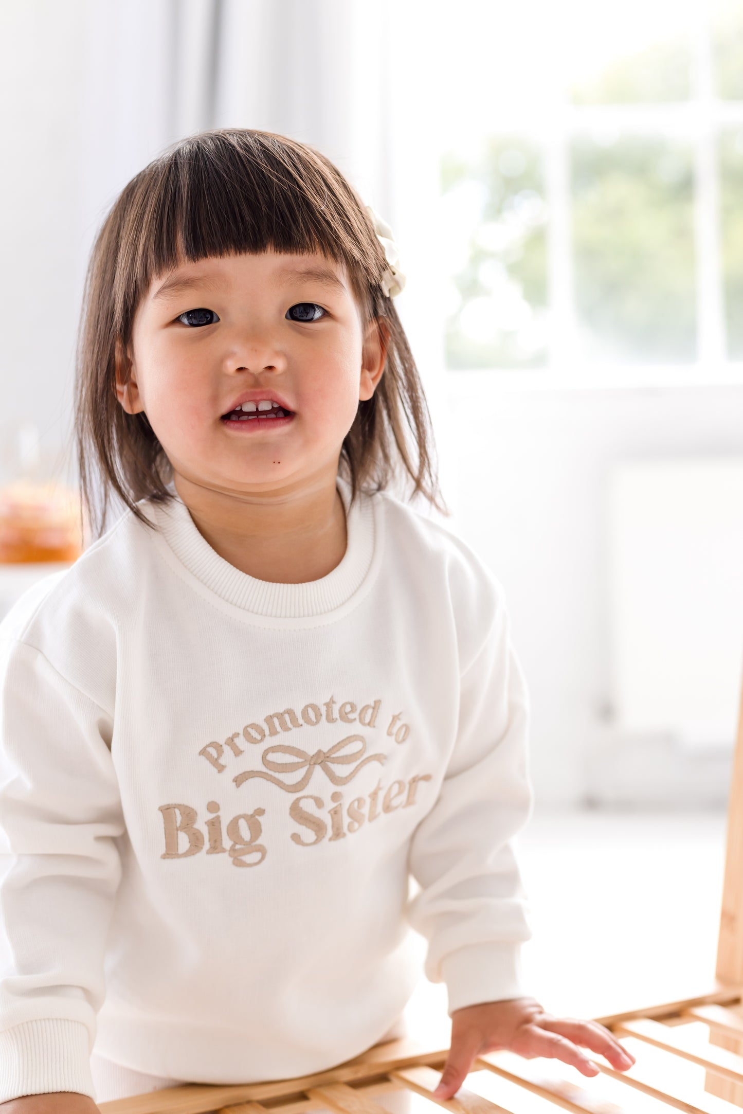 'Promoted to big sister' personalised embroidered bow sweatshirt