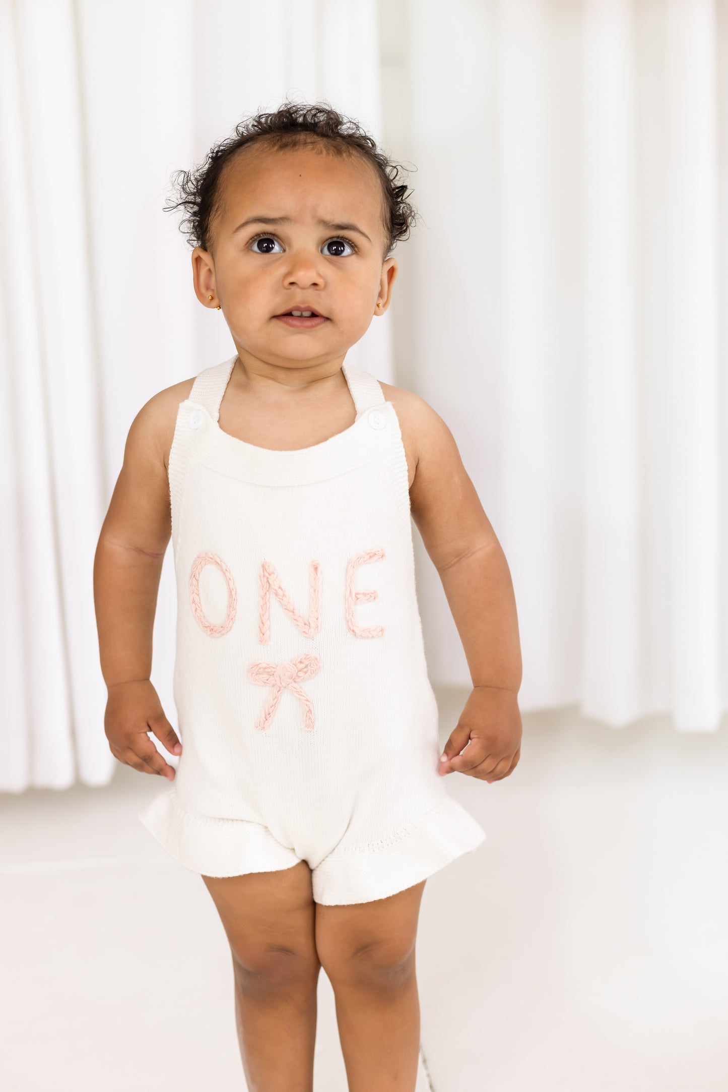 Baby First Birthday 'One' knitted frill and bow detail romper