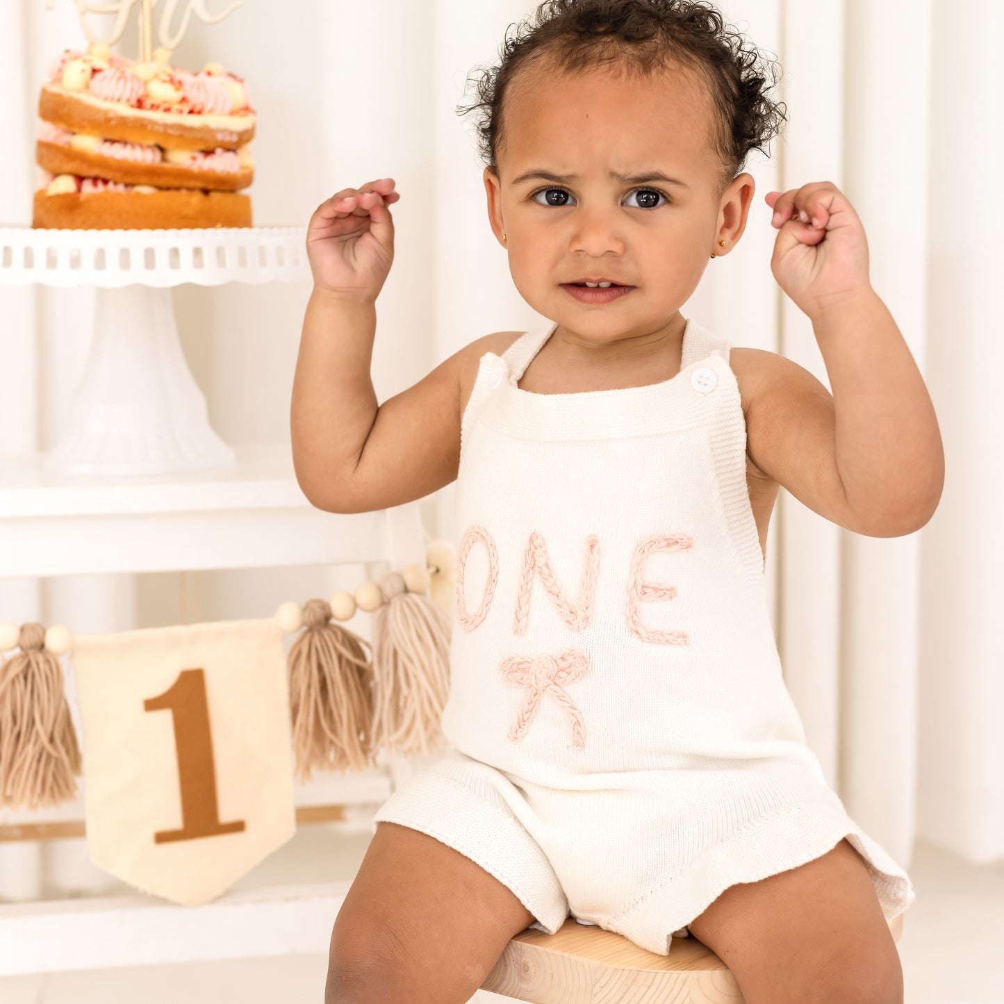Baby First Birthday 'One' knitted frill and bow detail romper