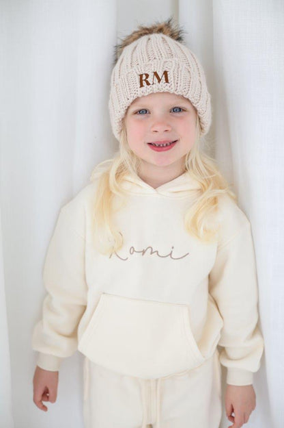 AW Embroidered initials faux fur pom pom hat