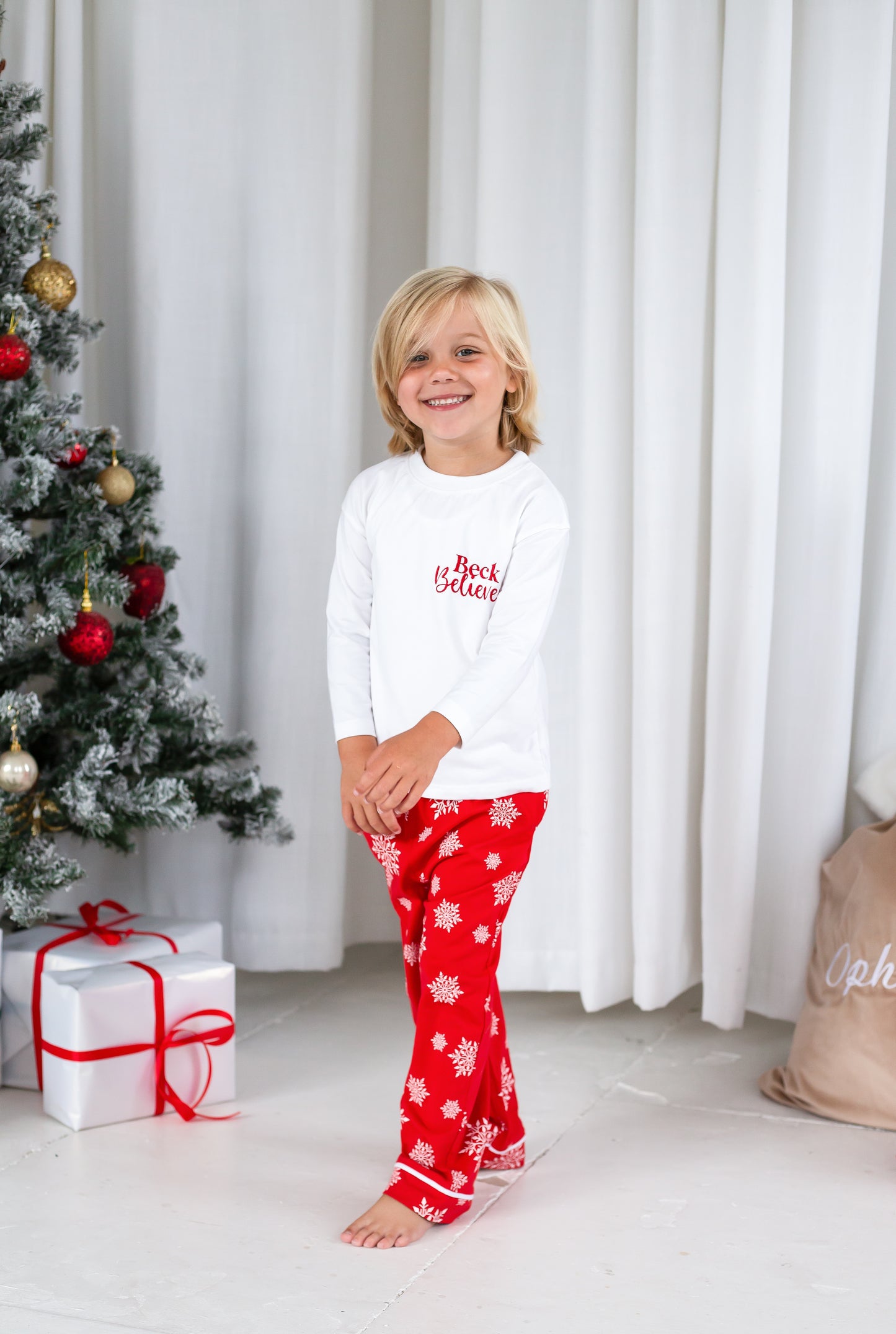 Family Christmas personalised 'Believes' snowflake jersey pyjamas in red and green