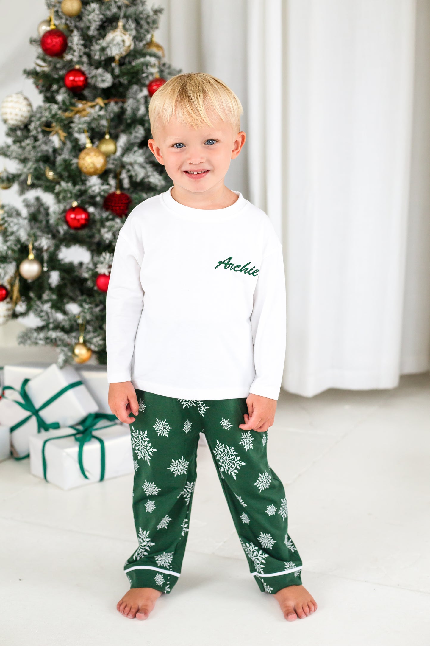 Family Christmas personalised snowflake jersey pyjamas in green and red