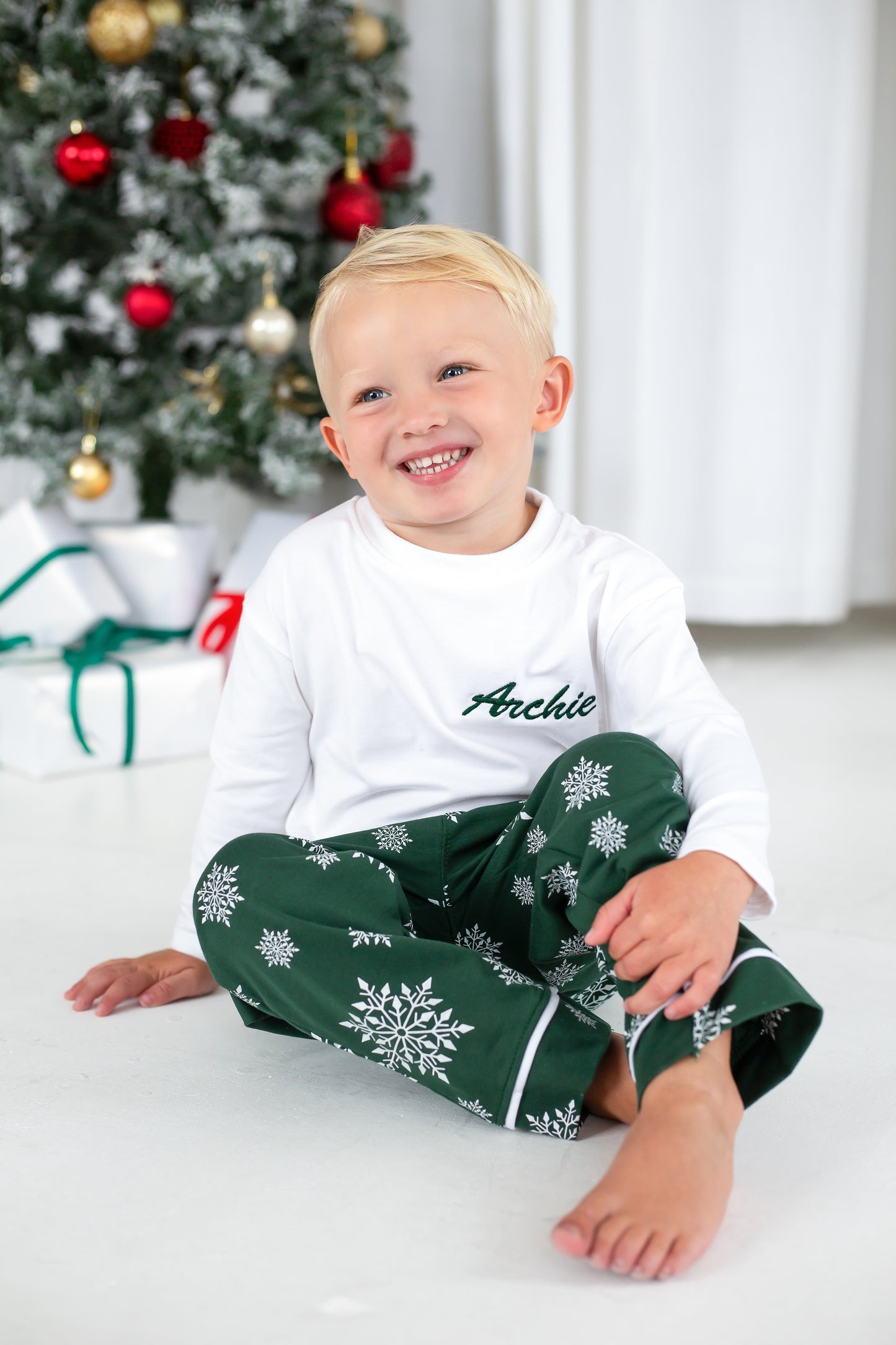 Family Christmas personalised snowflake jersey pyjamas in green and red